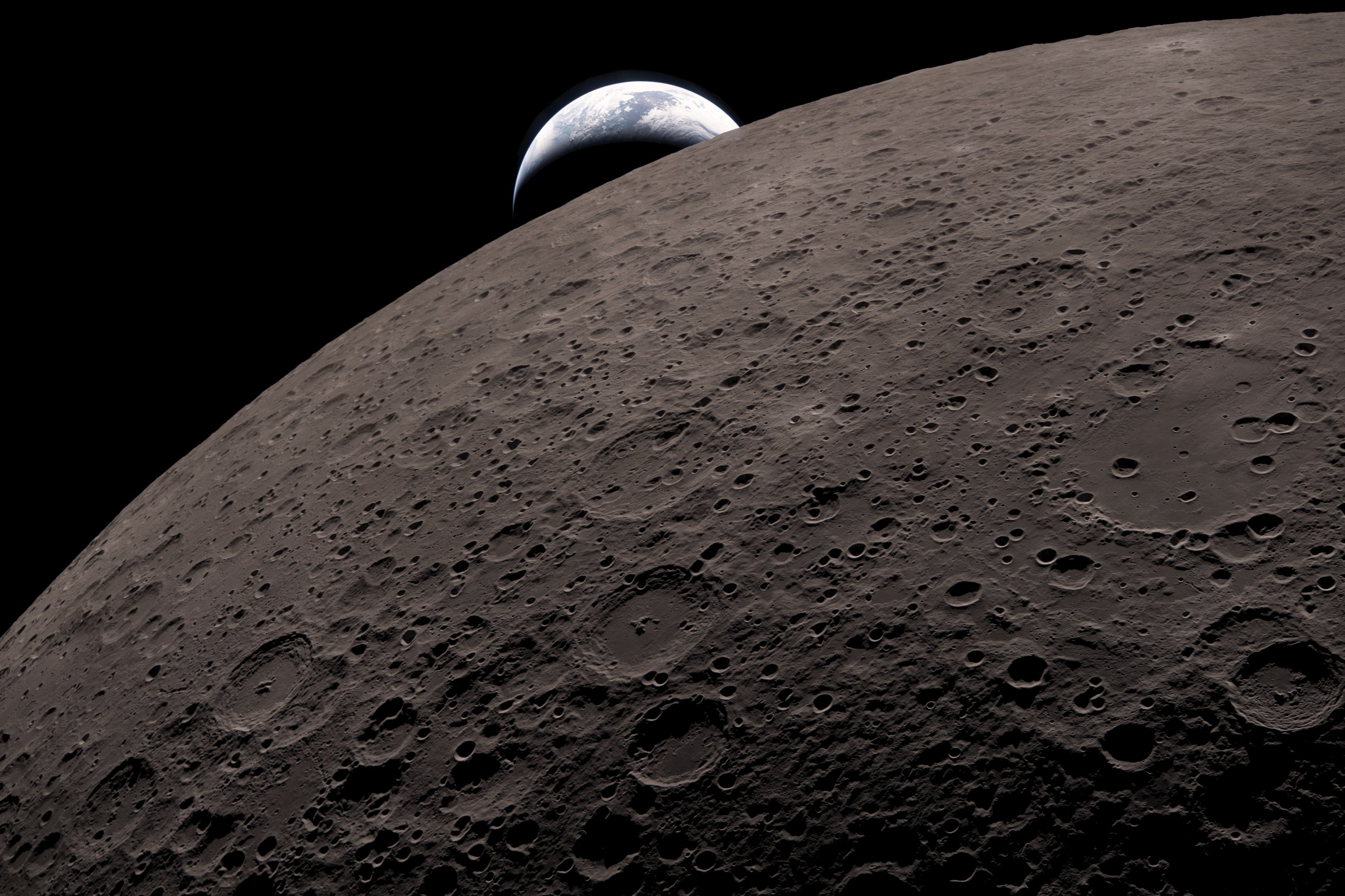 The Moon's limb cutting diagonally across the frame with a crescent Earth emerging behind it